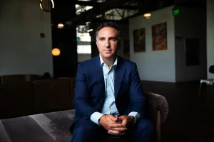 Aug. 24 Michael Gordon, above, was dismissed as a federal prosecutor after investigating those who stormed the Capitol on Jan. 6, 2021 (New York Times photo by Octavio Jones). New York Times, Reframing Jan. 6: After the Pardons, the Purge, Aug. 24, 2025. Dan Barry and Alan Feuer, Aug. 24, 2025. In its campaign of “uprooting the foot soldiers,” the Trump Justice Department has fired or demoted more than two dozen Jan. 6 prosecutors, even as those they sent to prison walk free. The lawyer took the elevator 32 floors to the U.S. attorney’s office, where for eight years he had worked as a highly regarded prosecutor. He had a container of homemade chocolate chip cookies to share and some thoughts to keep to himself.Listen to this article with reporter commentary “You have to be polite,” the lawyer, Michael Gordon, explained as the elevator rose. “But I don’t want to minimize it, or make it seem like everything’s OK. It’s not.” Mr. Gordon was heading up on this steaming late July day in Tampa, Fla., to collect his things and say goodbye. Three weeks earlier, and just two days after receiving yet another outstanding performance review, he had been interviewing a witness online when a grim-faced colleague interrupted to hand him a letter. It said he was being “removed from federal service effective immediately” — as in, now. Although the brief letter, signed by Attorney General Pam Bondi, provided no justification, Mr. Gordon knew the likely reason: Jan. 6, 2021. He was being fired for successfully prosecuting people who had stormed the United States Capitol that day — assaulting police officers, vandalizing a national landmark and disrupting that sacrosanct moment in a democracy, the transfer of presidential power. He was being fired for doing his job. The letter did more than inform Mr. Gordon, a 47-year-old father of two, that he was unemployed. It confirmed for him his view that the Justice Department he had been honored to work for was now helping to whitewash a traumatic event in American history, supporting President Trump’s reframing of its violence as patriotic — and those who had prosecuted rioters in the name of justice as villains, perhaps even traitors. In the seven months since Mr. Trump, newly returned to the White House, granted clemency to nearly 1,600 people charged in the largest criminal investigation in Justice Department history, his administration has turned the agency upside down. By tradition, the department long steered clear of White House intervention. Now, to remedy what the president has deemed the past weaponization of Justice, it has been deployed as a weapon for his score-settling and political crusades. To that end, it has sought to investigate and perhaps prosecute those who once investigated and prosecuted Mr. Trump and his allies, from the former special counsel, Jack Smith, to New York’s attorney general, Letitia James, to former President Barack Obama. The template for that transformation was Jan. 6 — the pardons and then the purge. To date, the Justice Department has fired or demoted more than two dozen prosecutors who were assigned to hold the rioters accountable — roughly a quarter of the complement. Some were junior prosecutors, like Sara Levine, who had secured a guilty plea from a rioter who had grabbed a police officer. Others were veterans, including Greg Rosen, who had led the department’s Jan. 6 task force. Scores more prosecutors, involved in these and other cases, have left, either in fear of where the ax might next fall or out of sheer disgust. The Justice Department declined to comment for this article, but a White House spokesman, Harrison Fields, described the agency during the Biden administration as “a cabal of anti-Trump sycophants” engaged in a “relentless pursuit to throw the book at President Trump and his allies.” By “uprooting the foot soldiers,” Mr. Fields added, Mr. Trump’s attorney general, Ms. Bondi, “is restoring the integrity of the department.” As he watched the Jan. 6 attack unfold on the television in his home office, Mr. Gordon recalled what a mentor had told him when he’d joined the Justice Department in 2017. “You’ve probably seen things happen, bad things, and thought to yourself, ‘Somebody should do something about that,’” he remembered her saying. “That’s now you. You are that somebody.” It was an inspiring message for someone who had taken a circuitous route to the law. He had taught high school history and humanities for several years before deciding to attend law school. An internship at the Queens district attorney’s office in New York sealed the deal. Now here he was, a federal prosecutor in Tampa, handling violent crime and narcotics cases — and he could be one of the somebodies who did something.