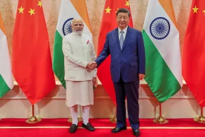 Prime Minister Narendra Modi of India, left, and President Xi Jinping of China on Sunday on the sidelines of the Shanghai Cooperation Organization summit in Tianjin, China, in a photo released by Mr. Modi’s office (Photo via Indian Prime Minister's Office and Associated Press).